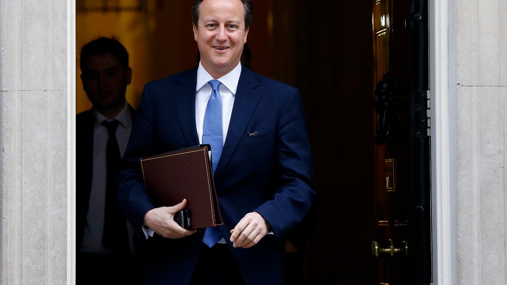 Britain's Prime Minister David Cameron smiles as he leaves 10 Downing Street in London, on Nov. 20, 2014.