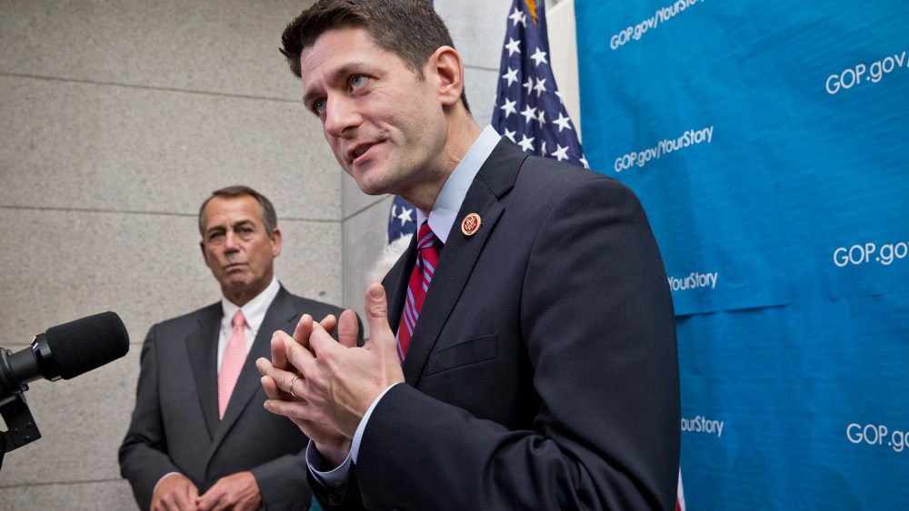 House Budget Committee Chairman Rep. Paul Ryan, R-Wis., right, accompanied by House Speaker John Boehner of Ohio, left, takes reporters' questions as during a news conference on Capitol Hill in Washington, Wednesday, December 11, 2013.