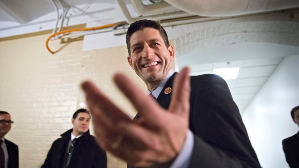House Budget Committee Chairman Rep. Paul Ryan, R-Wis., gestures as he walks through a basement corridor on Capitol Hill in Washington, Wednesday, Dec. 11, 2013.