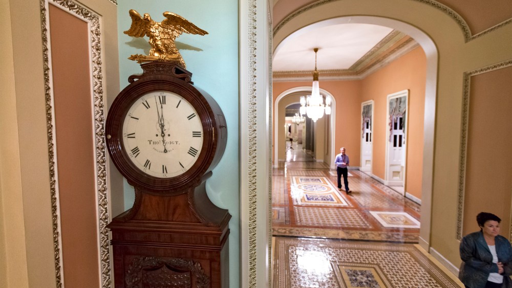 Just off the floor of the Senate, the hands on the famous Ohio Clock inch toward 12 midnight, the deadline for Congress to reach an agreement on funding the government, at the Capitol in Washington, September 30, 2013.