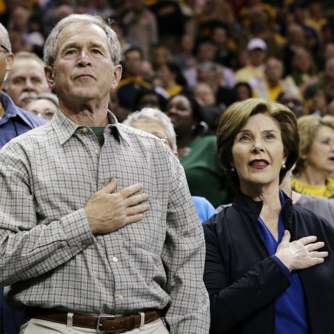 From left, Baylor President Ken Starr, former President George W. Bush and his wife Laura stand during the playing of the national anthem before a second-round game against Florida State in the women's NCAA college basketball tournament, Tuesday, March...