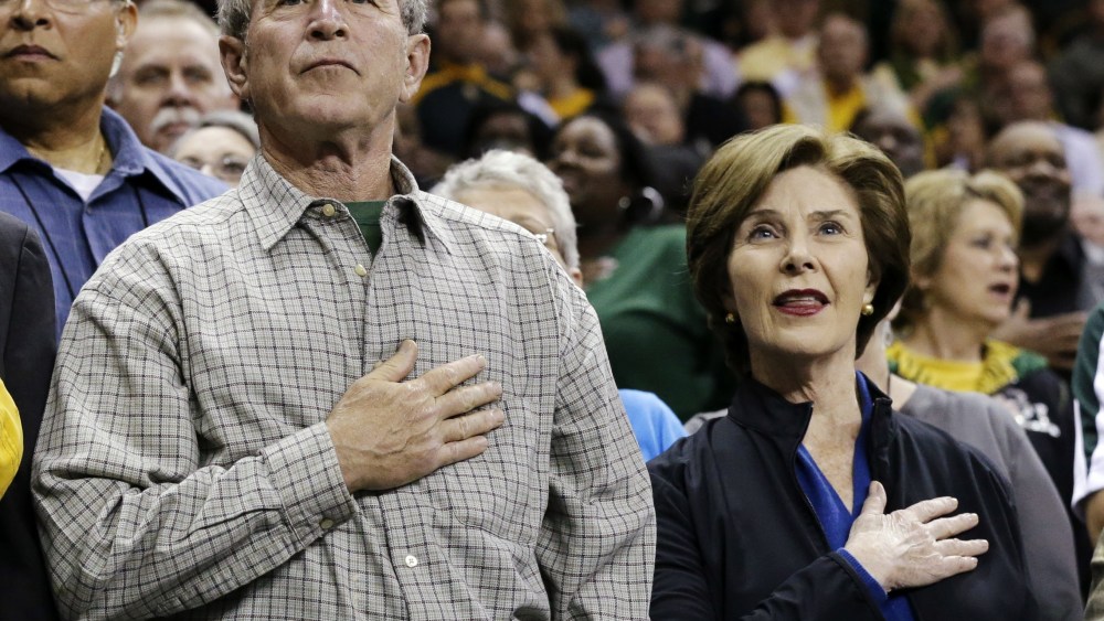 From left, Baylor President Ken Starr, former President George W. Bush and his wife Laura stand during the playing of the national anthem before a second-round game against Florida State in the women's NCAA college basketball tournament, Tuesday, March...