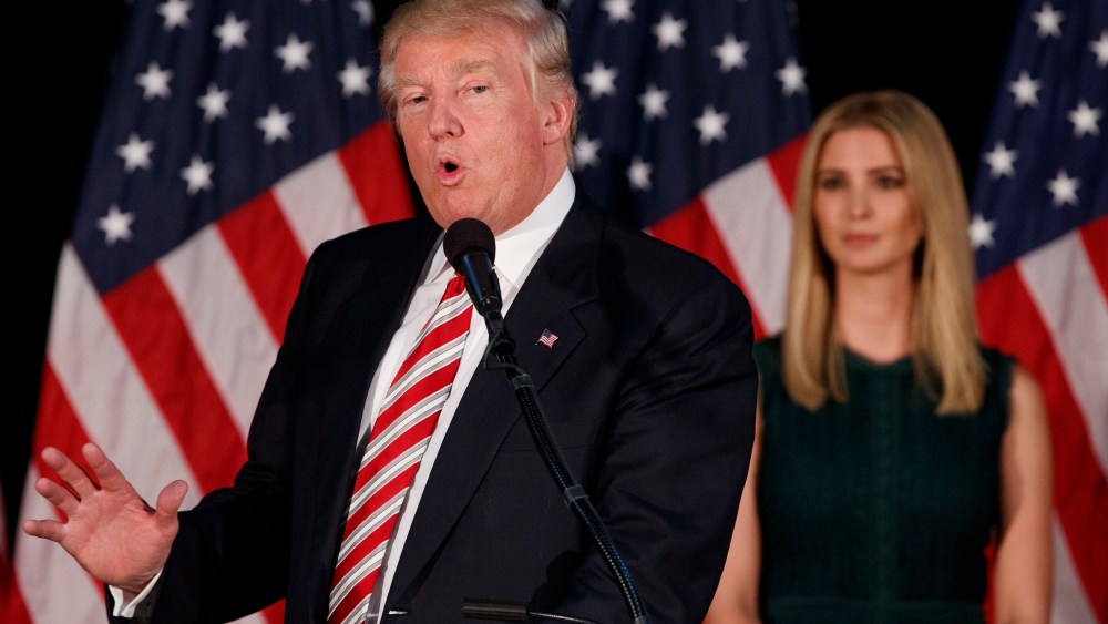 Ivanka Trump, right, listens as her father Republican presidential candidate Donald Trump delivers a policy speech on child care, Sept. 13, 2016, in Aston, Pa. (Photo by Evan Vucci/AP)