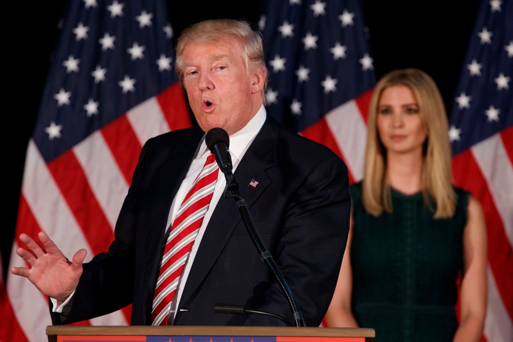 Ivanka Trump, right, listens as her father Republican presidential candidate Donald Trump delivers a policy speech on child care, Sept. 13, 2016, in Aston, Pa. (Photo by Evan Vucci/AP)