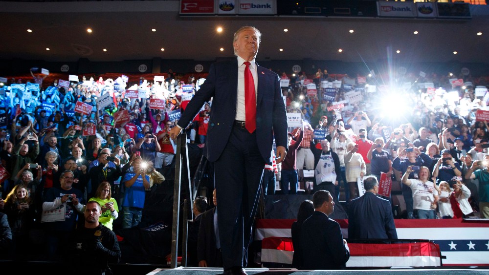 Republican presidential candidate Donald Trump arrives to speak at a campaign rally, Oct. 13, 2016, in Cincinnati, Ohio. (Photo by Evan Vucci/AP)