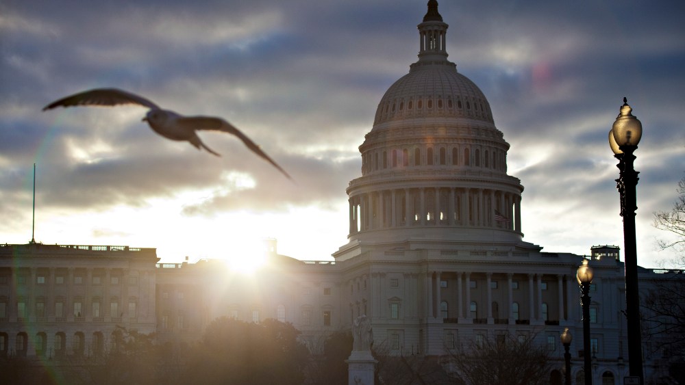 FILE  In this March 7, 2013, file photo the sun breaks through clouds over the U.S. Capitol in Washington. Daylight-saving time begins at 2 a.m. Sunday, March 10, 2013, when clocks officially move ahead an hour. (AP Photo/J. Scott Applewhite, File)