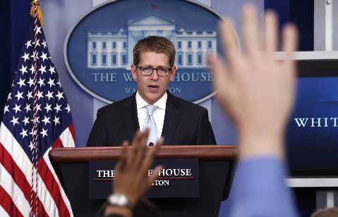 Hands are raised as White House Press Secretary Jay Carney speaks to reporters in the briefing room of the White House in Washington May 14, 2013. The White House, under pressure over reports that the Department of Justice tracked Associated Press...