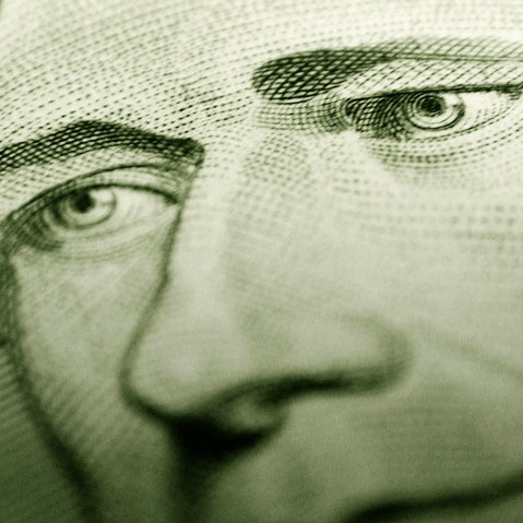 Detail of Alexander Hamilton's portrait on a $10 bill. (Photo by Digital Art/Corbis)