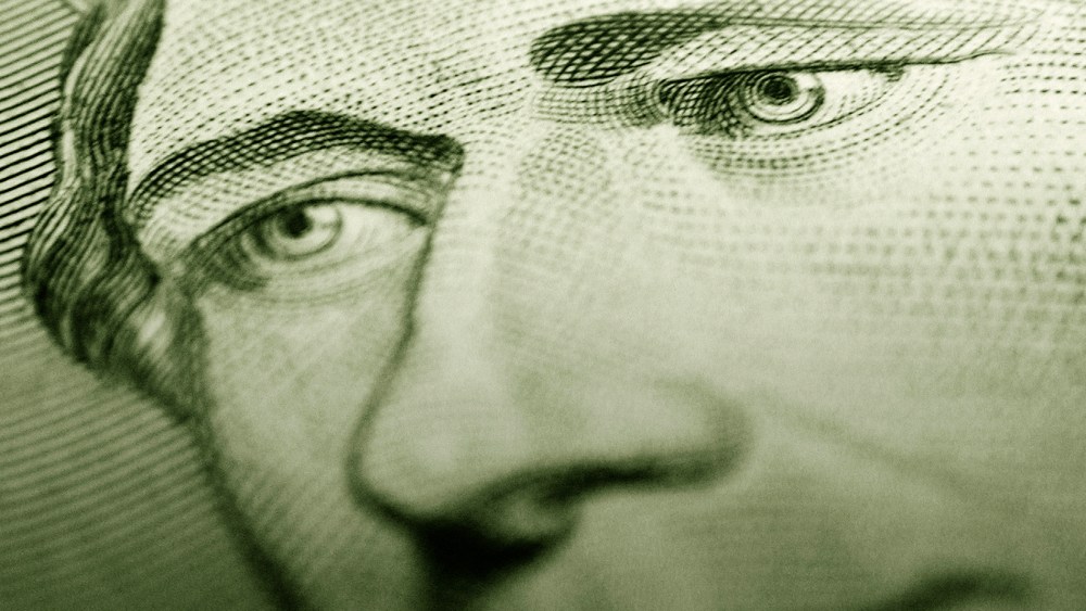 Detail of Alexander Hamilton's portrait on a $10 bill. (Photo by Digital Art/Corbis)