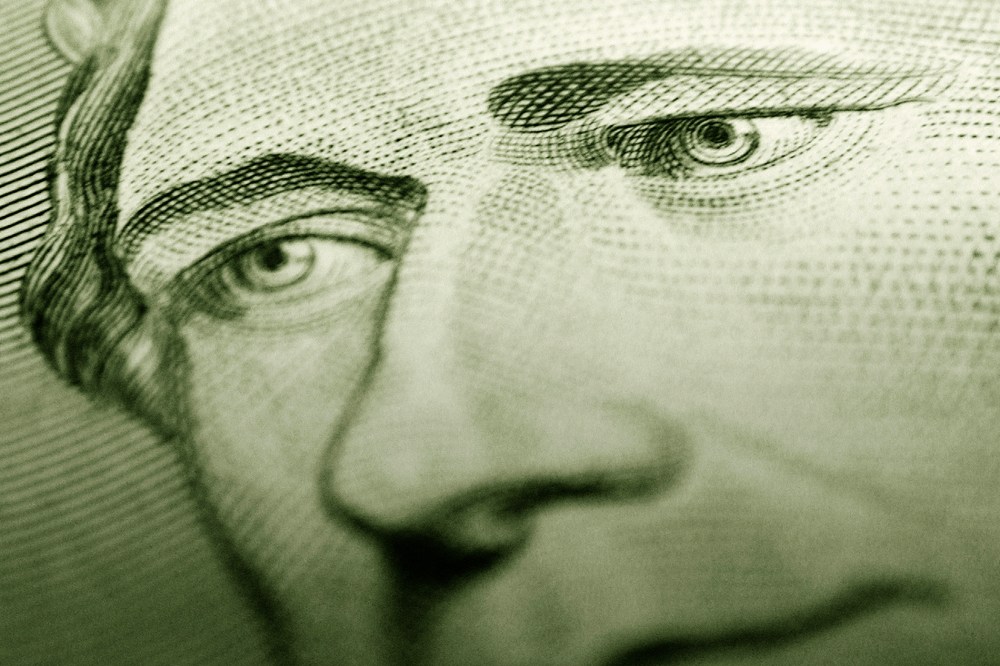 Detail of Alexander Hamilton's portrait on a $10 bill. (Photo by Digital Art/Corbis)