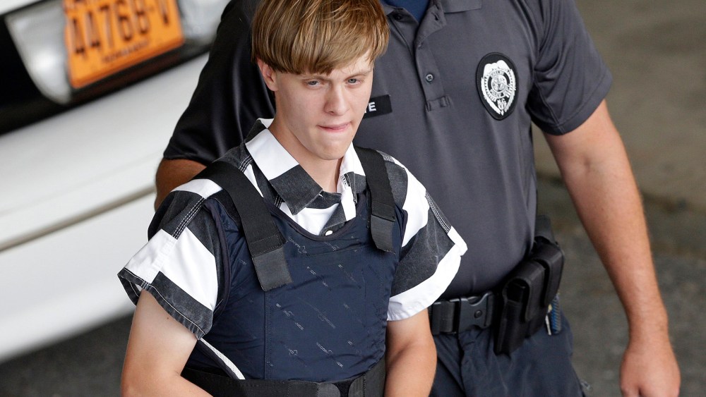 Charleston, S.C., shooting suspect Dylann Storm Roof is escorted from the Cleveland County Courthouse in Shelby, N.C., June 18, 2015. (Photo by Chuck Burton/AP)