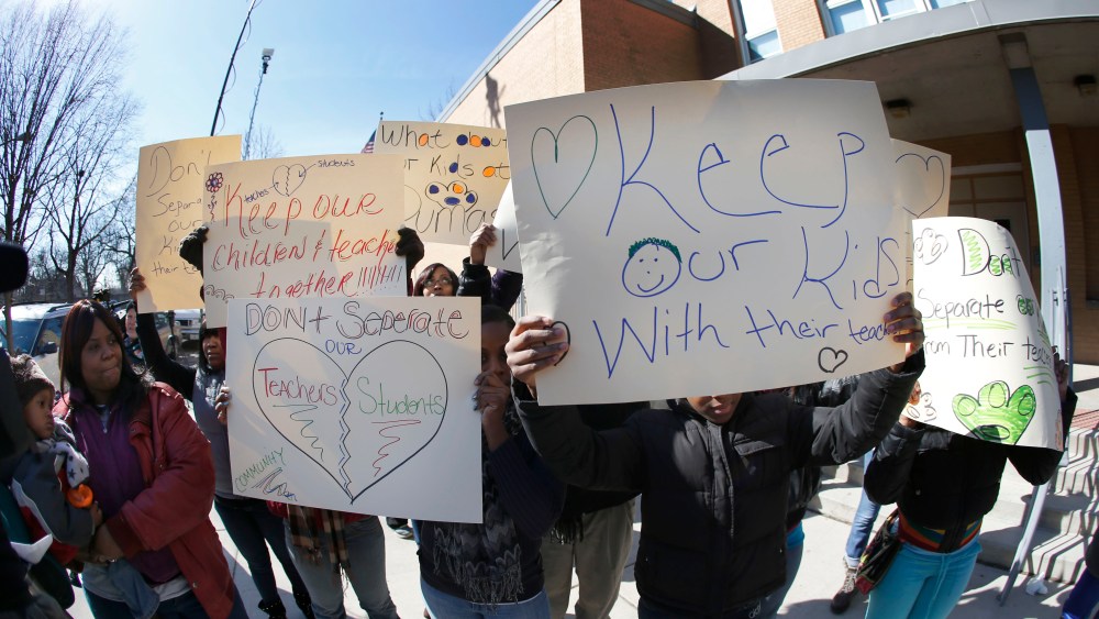 Parents of students at the Dumas Technology Academy Elementary School protest outside the school, the proposed closing of the Southside facility Friday, March 22, 2013, in Chicago. Chicago Public Schools officials ended months of speculation when they...