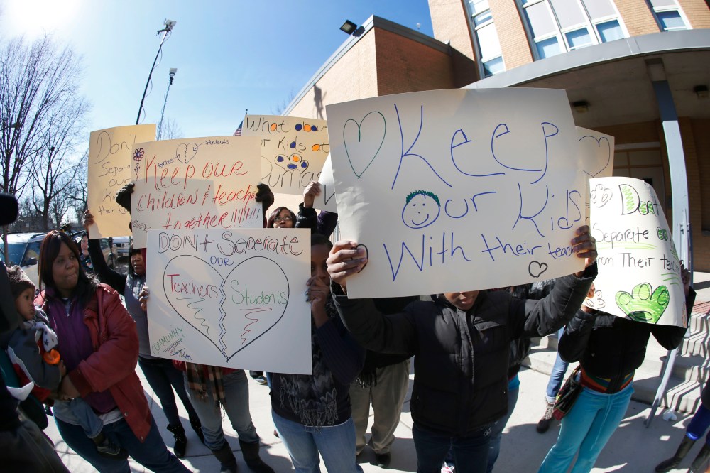 Parents of students at the Dumas Technology Academy Elementary School protest outside the school, the proposed closing of the Southside facility Friday, March 22, 2013, in Chicago. Chicago Public Schools officials ended months of speculation when they...