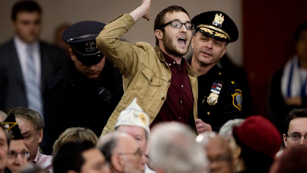 Rowan University student Michael Brein shouts at New Jersey Gov. Chris Christie, as he is removed from a town hall meeting, on March 13, 2014, in Mount Laurel, N.J.