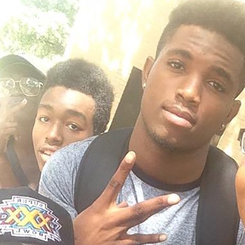 Christian Taylor, pictured with a gray shirt and black backpack, in a photograph taken by his friend and classmate, Liz. (Photo courtesy of @_lawjohnson)