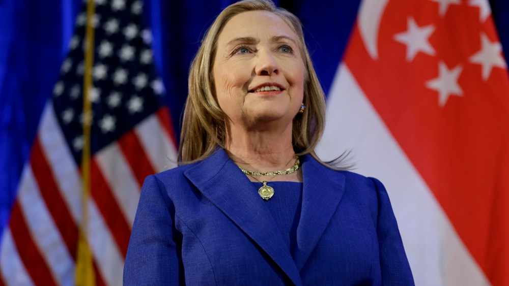 U. S. Secretary of State Hillary Rodham Clinton waits to speak as she is introduced at Singapore Management University, Saturday, Nov. 17, 2012, in Singapore. (AP Photo/Matt Rourke, Pool)