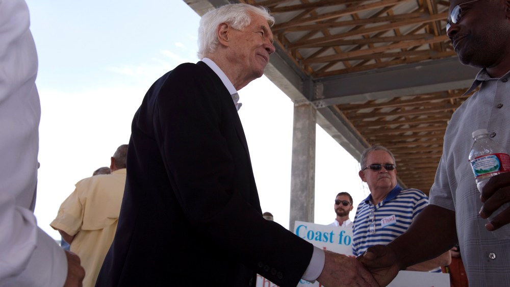 Senator Thad Cochran (L) campaigns in the Gulf Coast city of Pass Christian, Mississippi, June 19, 2014.