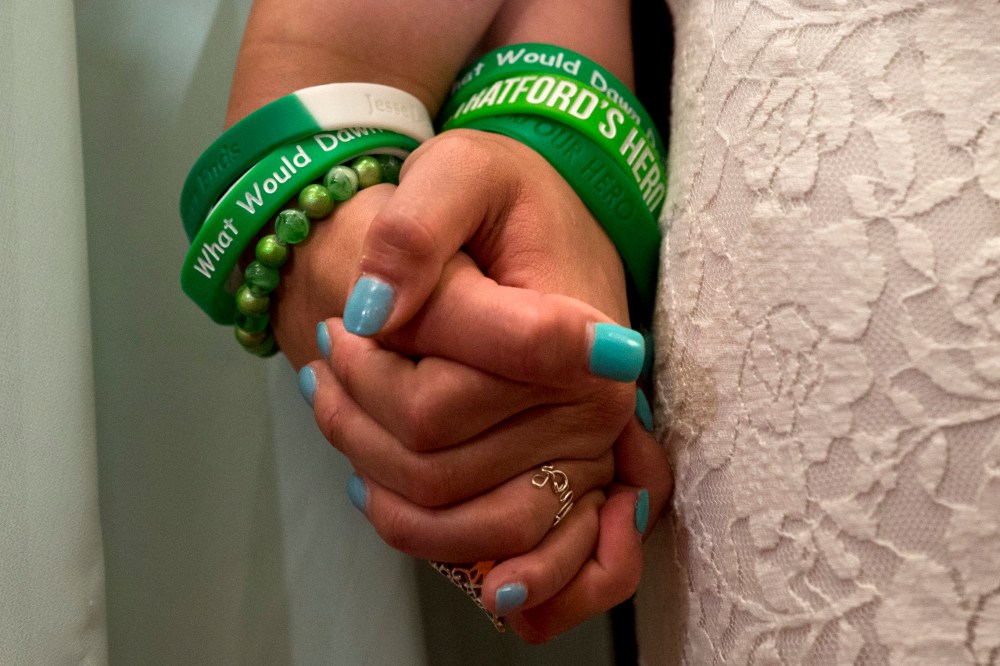 Jillian Soto, left, and Carlee Soto, sisters of Newtown, Conn. shooting victim Victoria Soto, hold hands during a news conference on Capitol Hill in Washington, Thursday, June 13, 2013,  (AP Photo/Jacquelyn Martin)