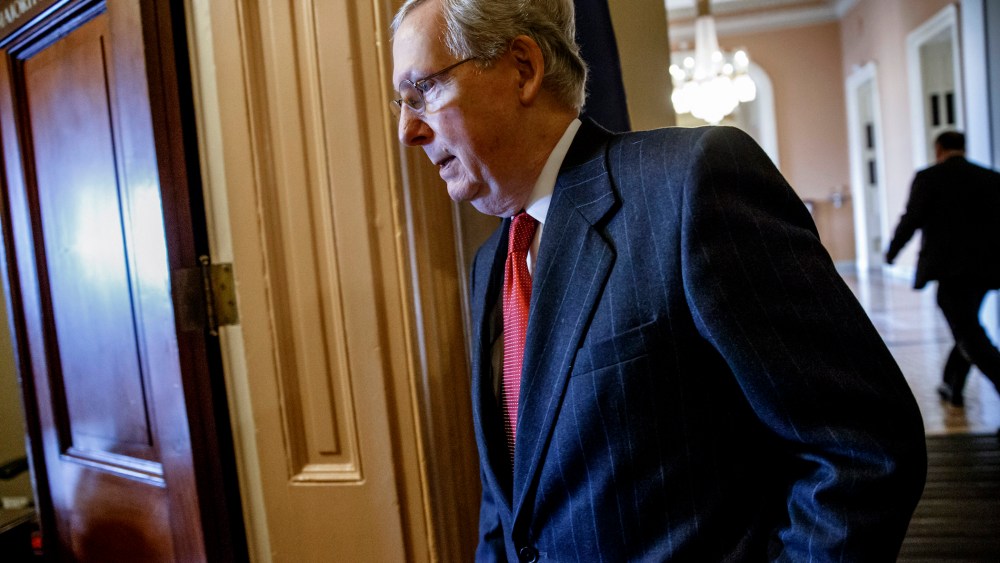 Senate Majority Leader Mitch McConnell walks to his office from the Senate chamber on Capitol Hill in Washington, on Jan. 8, 2015. (Photo by J. Scott Applewhite/AP)