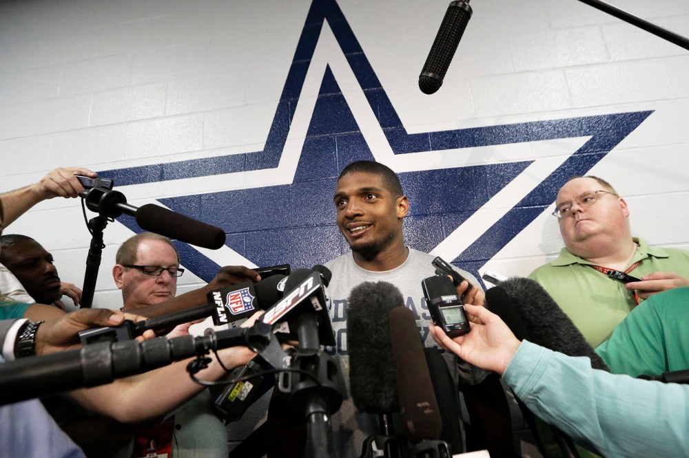 Dallas Cowboys practice squad player defensive end Michael Sam smiles as he speaks to reporters after team practice at the team's headquarters, Sept. 3, 2014, in Irving, Texas.