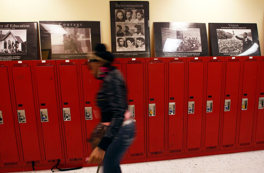 A student at Walter H. Dyett High School walks through the hallway in Chicago, Illinois, in this photo taken on October 5, 2012. The bipartisan education reform movement sweeping the nation calls for rating schools by their students' test scores and...