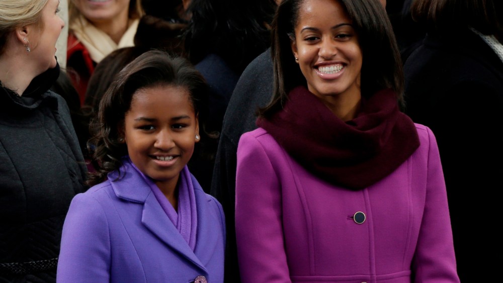 Sasha and Malia Obama arrive at the ceremonial swearing-in of their father President Barack Obama at the U.S. Capitol during the 57th Presidential Inauguration in Washington, Monday, Jan. 21, 2013. (AP Photo/Pablo Martinez Monsivais)
