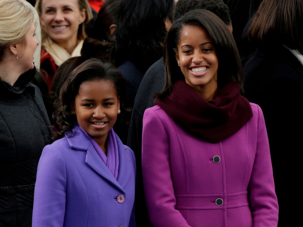 Sasha and Malia Obama arrive at the ceremonial swearing-in of their father President Barack Obama at the U.S. Capitol during the 57th Presidential Inauguration in Washington, Monday, Jan. 21, 2013. (AP Photo/Pablo Martinez Monsivais)