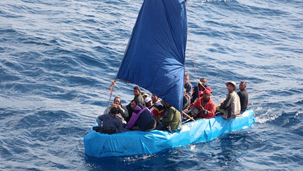 This Jan. 1, 2015 photo provided by the U.S. Coast Guard shows 24 Cuban migrants in the waters south of Key West, Fla