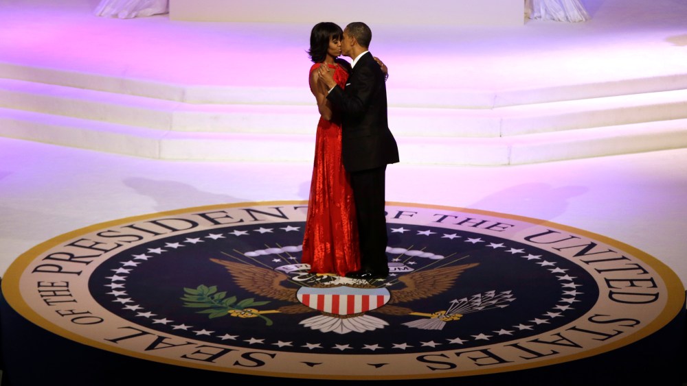 President Barack Obama and first lady Michelle Obama kiss as they dance during the Commander-In-Chief inaugural ball at the Washington Convention Center during the 57th Presidential Inauguration on Monday, Jan. 21, 2013 in Washington.  (Photo by  Evan...
