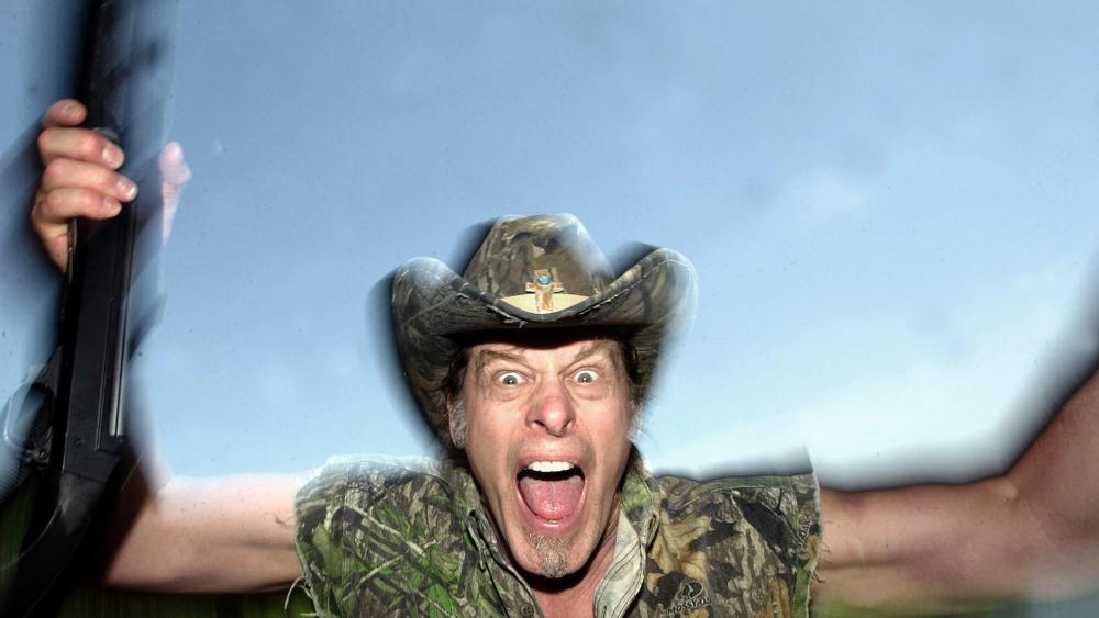 In this file photo Ted Nugent screams for a photo at his ranch near Crawford, Texas, Friday, April 22, 2005.