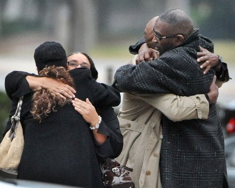 Ron Davis, the father of Jordan Davis is embraced as he arrives at the funeral home for the visitation and a memorial service for his son Jordan, Wednesday, Nov. 28, 2012 in Jacksonville, Fla.(Photo by Bob Self/AP Photo/The Florida Times-Union)