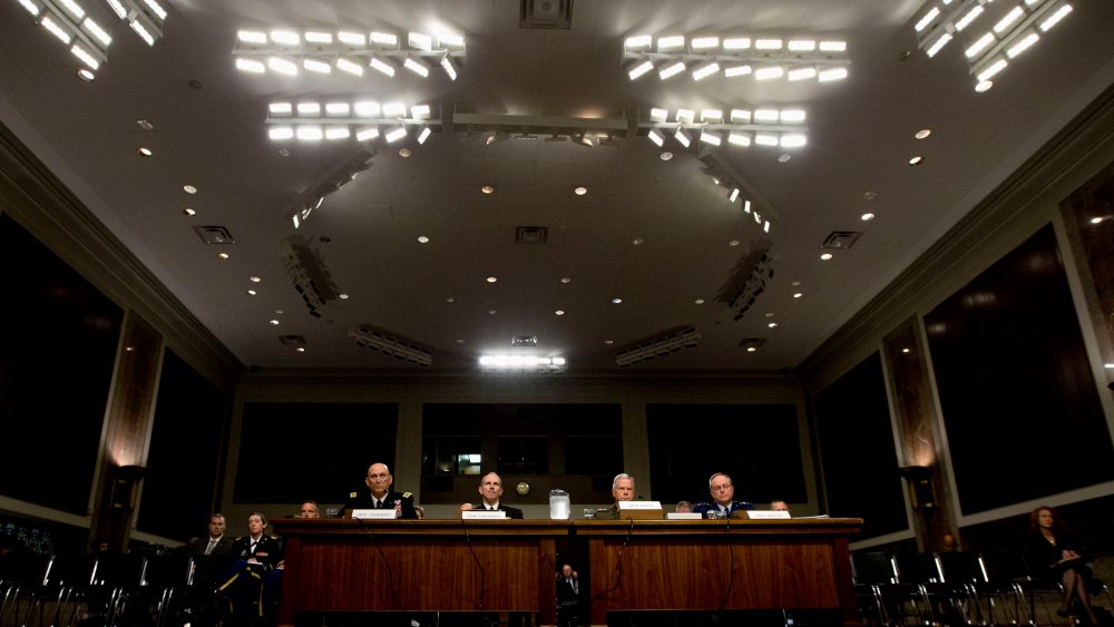 Pentagon officials are seen on Capitol Hill in Washington, Thursday, Nov. 7, 2013.