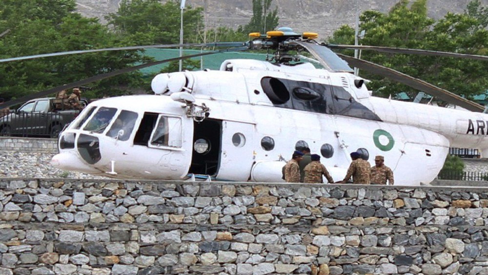 Pakistani soldiers gather beside an army helicopter at a military hospital where victims of a helicopter crash were brought for treatment in Gilgit on May 8, 2015. (Photo by Farman Karim/AFP/Getty)