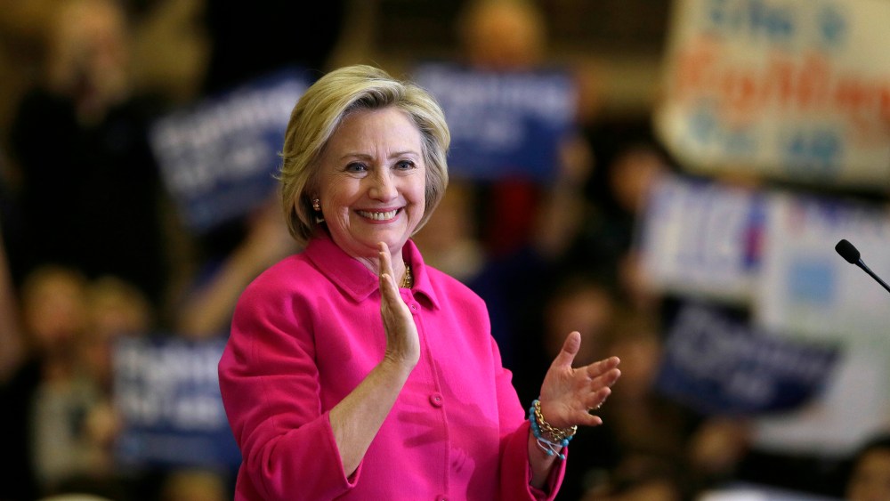 Democratic presidential candidate Hillary Clinton reacts to supporters after speaking at a campaign rally at the Iowa State Historical Museum, Jan. 4, 2016, in Des Moines, Iowa. (Photo by Charlie Neibergall/AP)