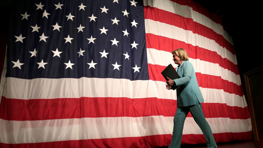 Democratic presidential candidate Hillary Rodham Clinton walks off the stage after speaking at the at the Iowa Democratic Wing Ding at the Surf Ballroom, Aug. 14, 2015, in Clear Lake, Iowa. (Photo by Charlie Riedel/AP)