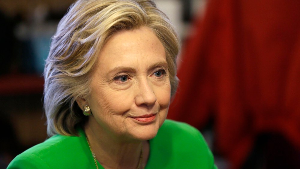 Democratic presidential candidate Hillary Rodham Clinton meets with local residents at the Jones St. Java House in LeClaire, Iowa on April 14, 2015.
