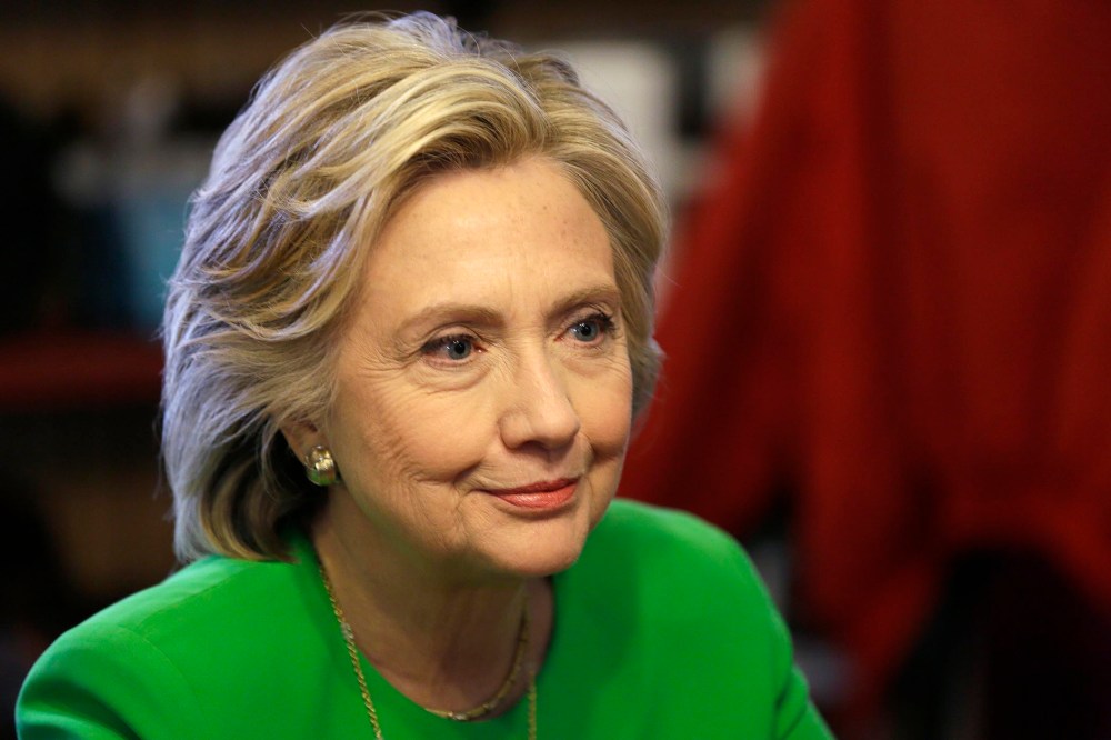 Democratic presidential candidate Hillary Rodham Clinton meets with local residents at the Jones St. Java House in LeClaire, Iowa on April 14, 2015.