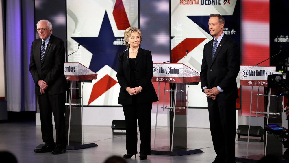 Democratic presidential candidates Bernie Sanders, left, Hillary Rodham Clinton and Martin O'Malley take the stage before a Democratic presidential primary debate, Nov. 14, 2015, in Des Moines, Iowa. (Photo by Charlie Neibergall/AP)