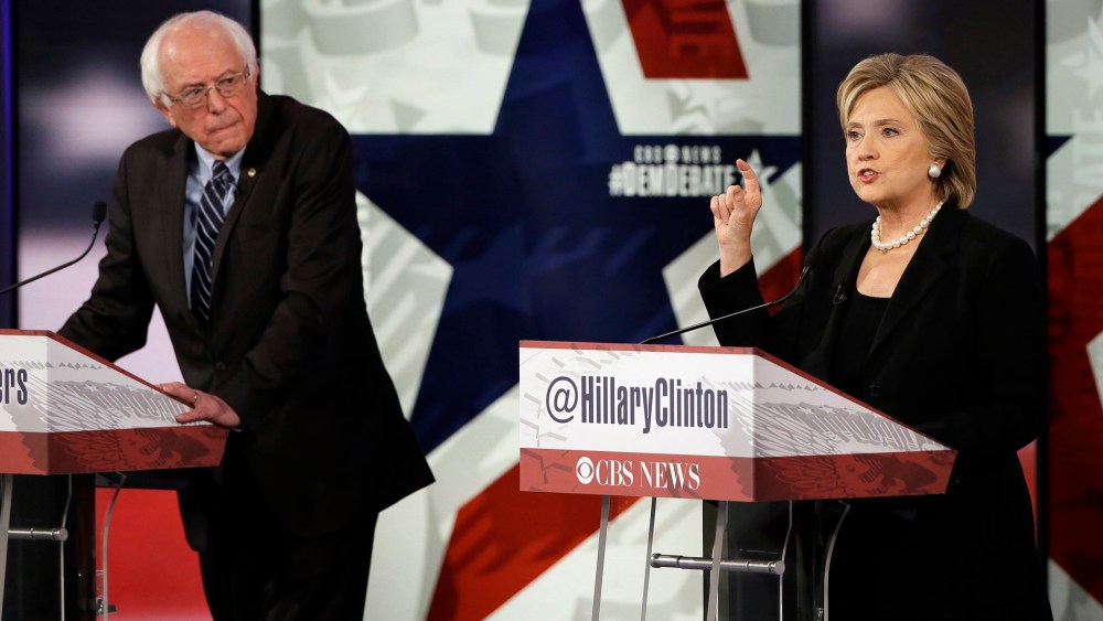 Hillary Rodham Clinton, right, makes a point as Bernie Sanders listens during a Democratic presidential primary debate, Nov. 14, 2015, in Des Moines, Iowa. (Photo by Charlie Neibergall/AP)