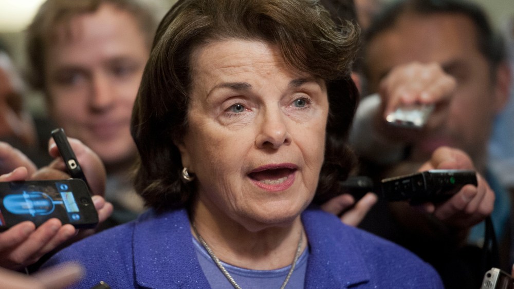 Senate Intelligence Committee Chair Sen. Dianne Feinstein, D-Calif., is surrounded by reporters on Capitol Hill in Washington, Friday, Nov. 16, 2012, following a closed-door hearing of the committee where former CIA Director David Petraeus testified. ...