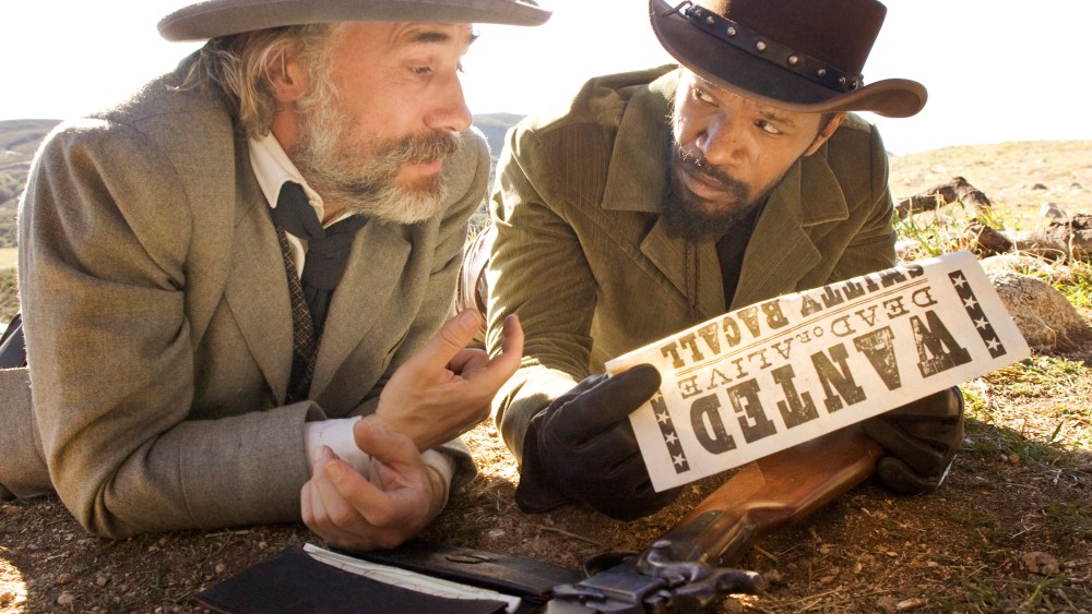 This undated publicity image released by The Weinstein Company shows, Christoph Waltz as Schultz, left, and Jamie Foxx as Django in the film, "Django Unchained," directed by Quentin Tarantino. Foxx says Hollywood should take some responsibility for...