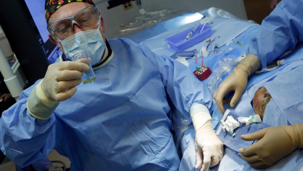 Dr. Alejandro Berenstein, Director at the Center for Endovascular Surgery in an operating room of New York's Roosevelt Hospital, Tuesday, March 5, 2013.  (AP Photo/Richard Drew)
