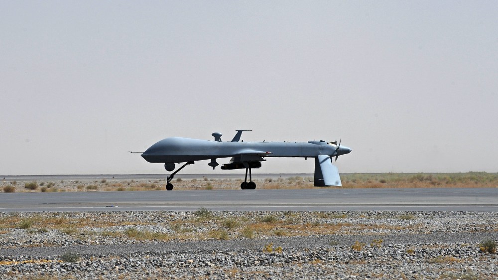 FILE - In this June 13, 2010, file photo a U.S. Predator unmanned drone armed with a missile stands on the tarmac of Kandahar military airport in Afghanistan. Hunting al-Qaida targets from Pakistan to Afghanistan, Yemen to Somalia, the fleet of U.S....