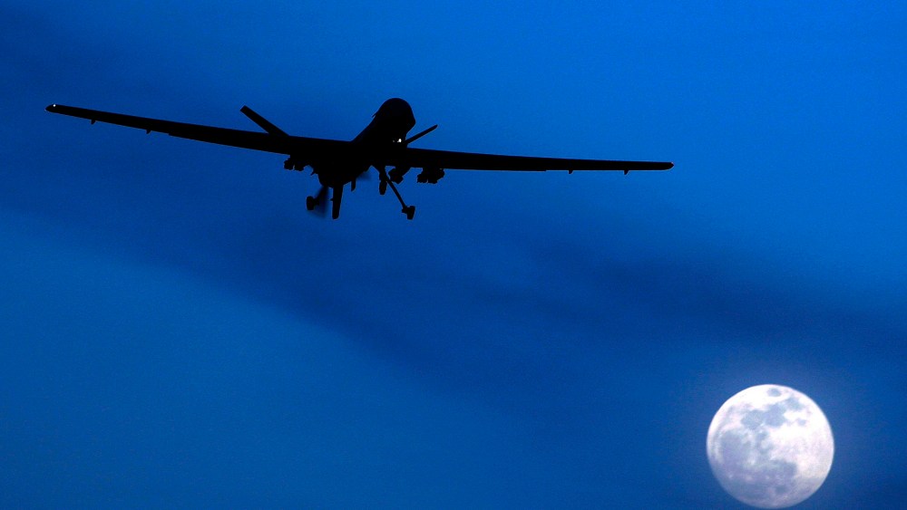 In this Jan. 31, 2010 file photo, an unmanned U.S. Predator drone flies over Kandahar Air Field, southern Afghanistan, on a moon-lit night. (Photo: AP Photo/Kirsty Wigglesworth)
