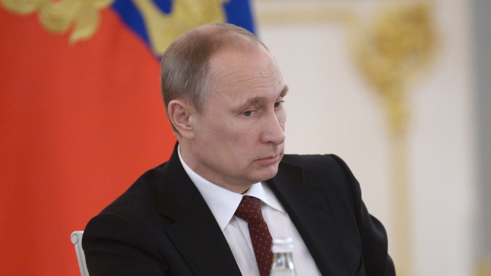 Russian President Vladimir Putin chairs a government meeting at the Kremlin in  Moscow, on March 24, 2014.