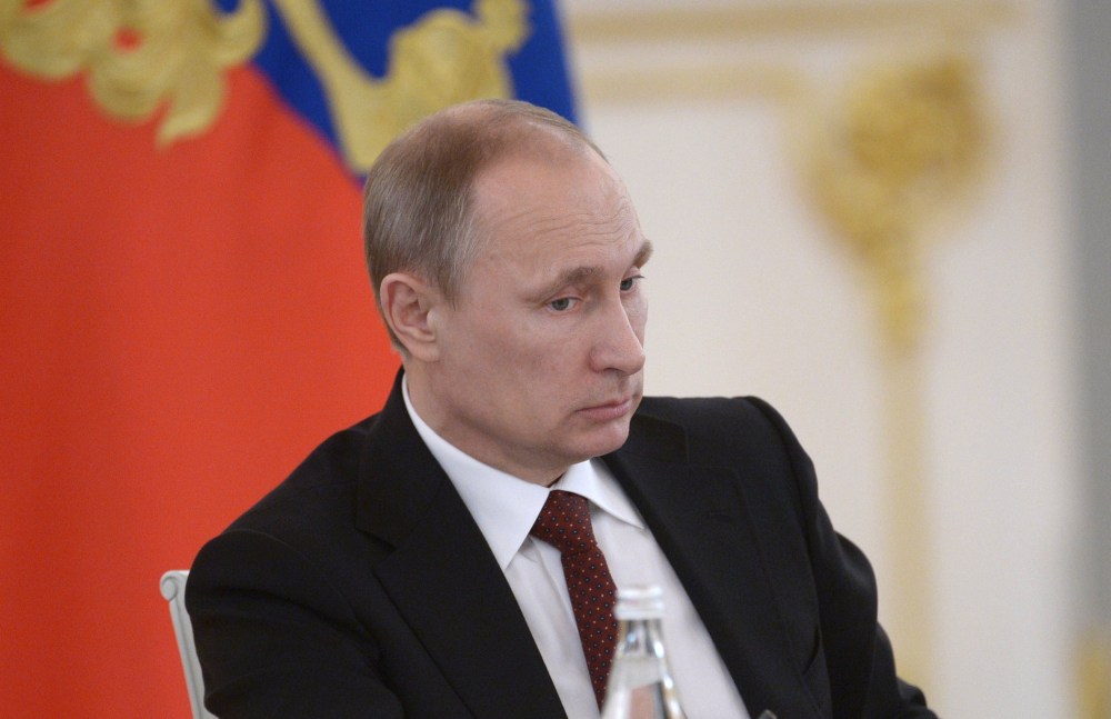 Russian President Vladimir Putin chairs a government meeting at the Kremlin in Moscow, on March 24, 2014.