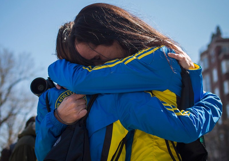Boston Marathon runners Lisa Kresky-Griffin and Tammy Snyder embrace at the barricaded entrance at Boylston Street near the finish line of the Boston Marathon in Boston, Massachusetts on April 16, 2013. (Photo by Shannon Stapleton/Reuters)