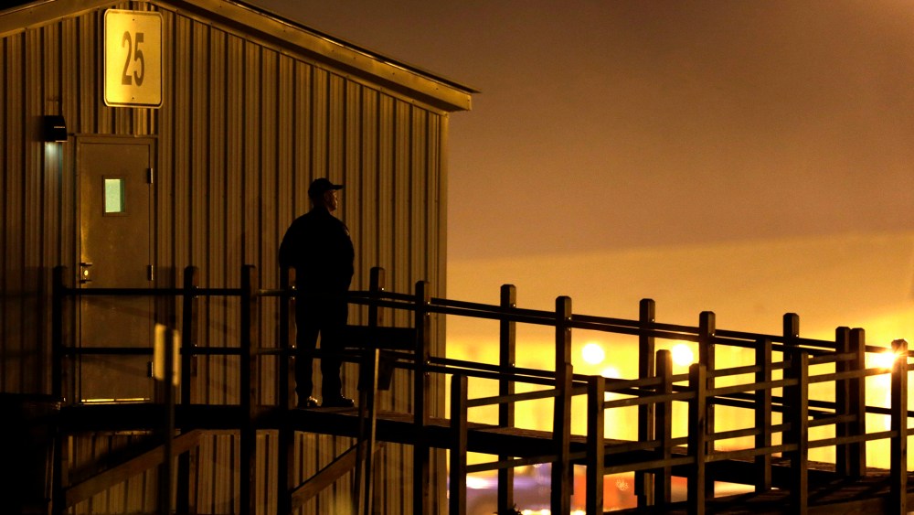 Security personnel stands outside the Eastern Reception, Diagnostic & Correctional Center in in Bonne Terre, Mo., before an execution on Nov. 19, 2013.