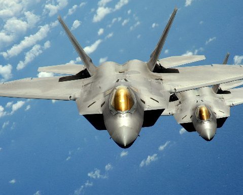 Two U.S. Air Force F-22 Raptor stealth jet fighters fly near Andersen Air Force Base in Guam in this handout photo dated August 4, 2010.   REUTERS/U.S. Air Force/Master Sgt. Kevin J. Gruenwald/Handout