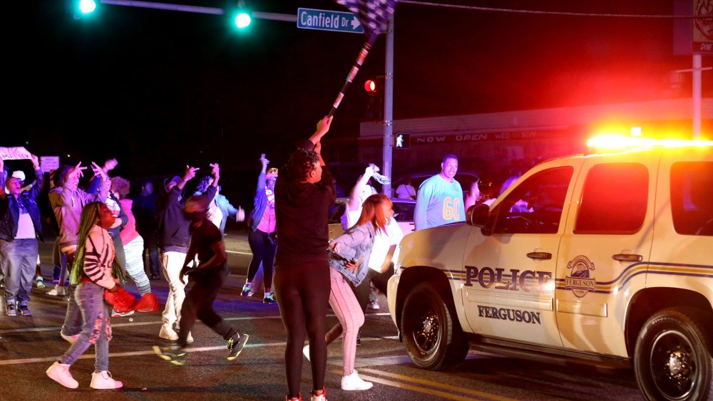 Protesters block the intersection of West Florissant Avenue and Canfield Drive in Ferguson, Mo., Tuesday night, April 28, 2015. (Photo by David Carson/St. Louis Post-Dispatch/AP)